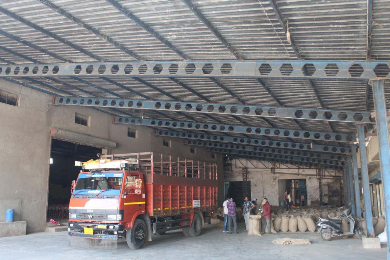 Loading dock with truck being loaded with cattle feed bags for bulk B2B dispatch from Shri Agrawal Agro Industries